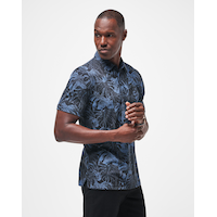 TravisMathew Men's Mainlanders Polo T Shirt Front_Three_Fourths_Angled_Right